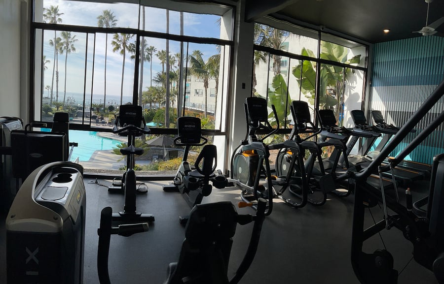 Full gym overlooking pool/spa.