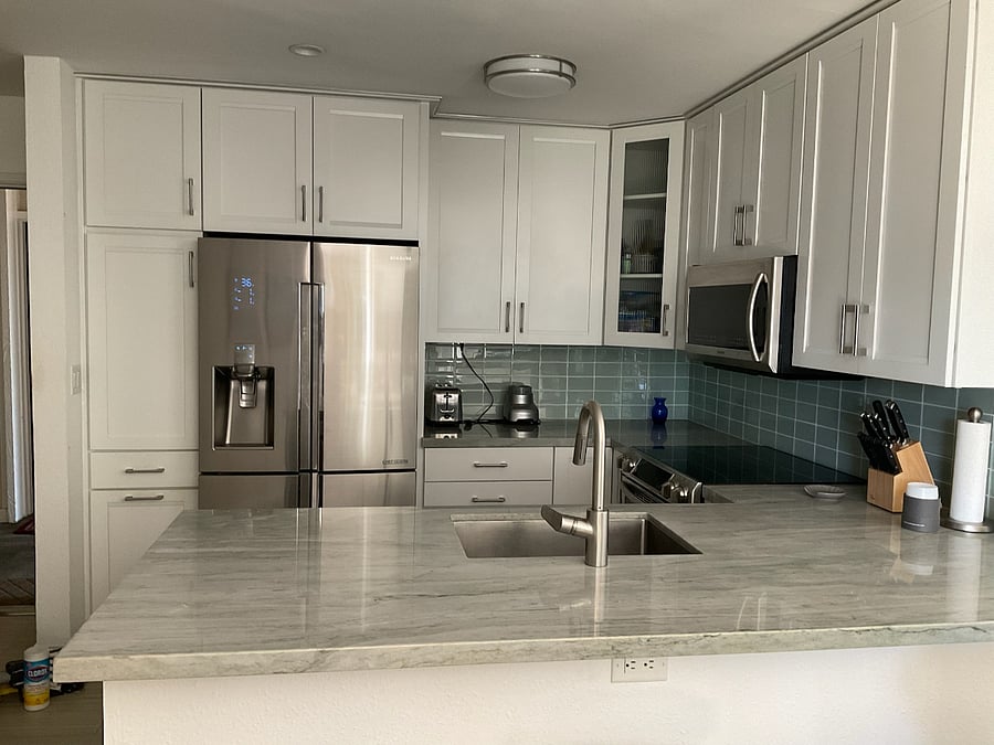 Full kitchen with marble countertops