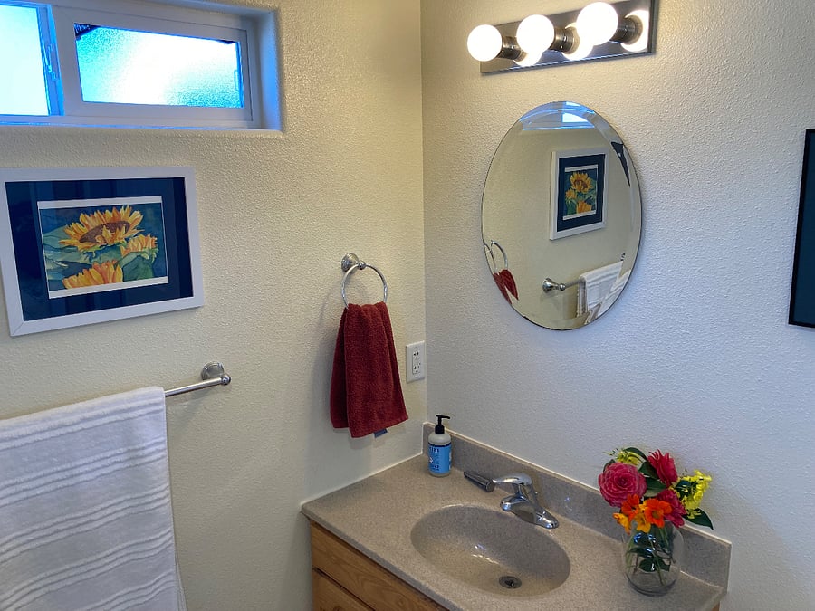 Charming, well-lit bathroom