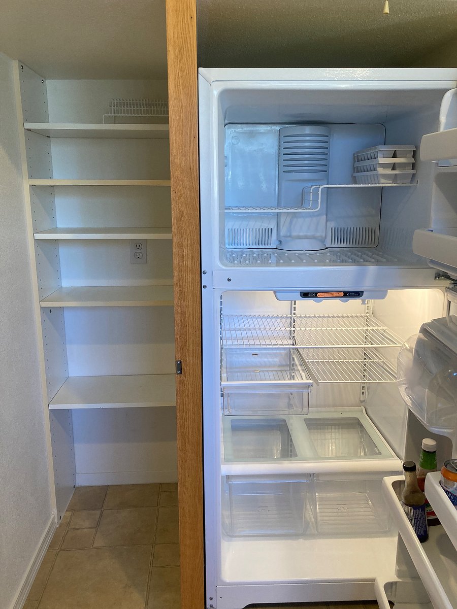 Clean pantry and full-sized refridgerator