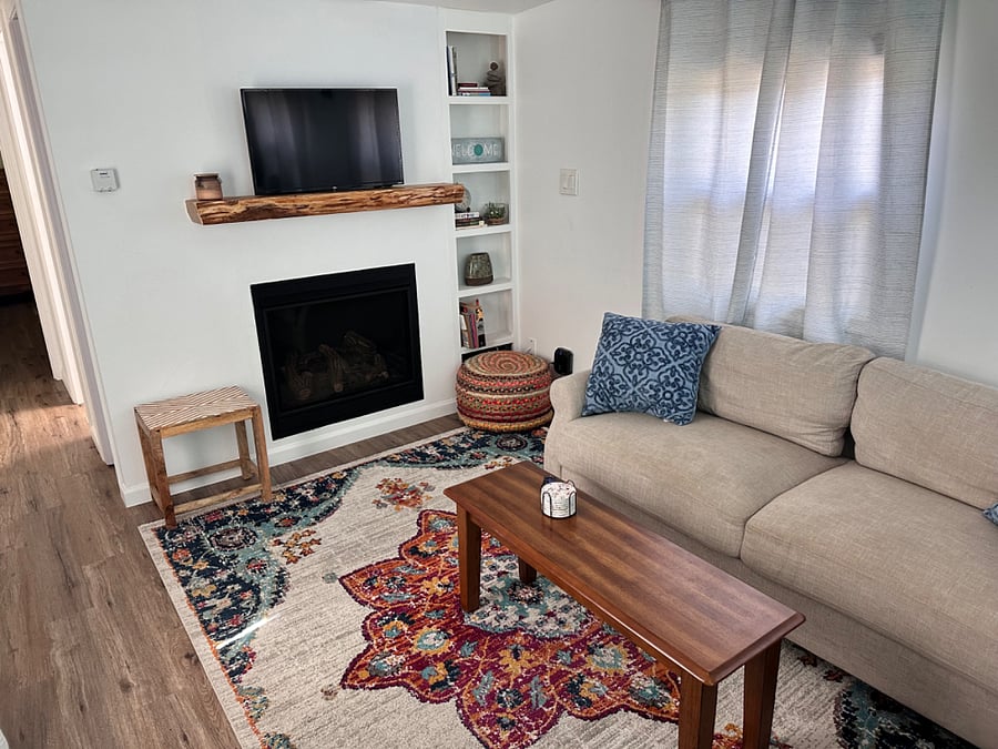 View of gas fireplace below tv