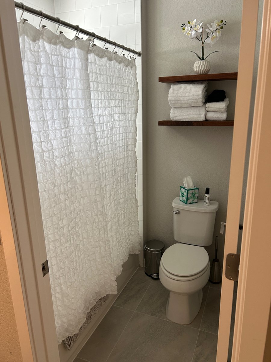 Guest bathroom shared with private home office.