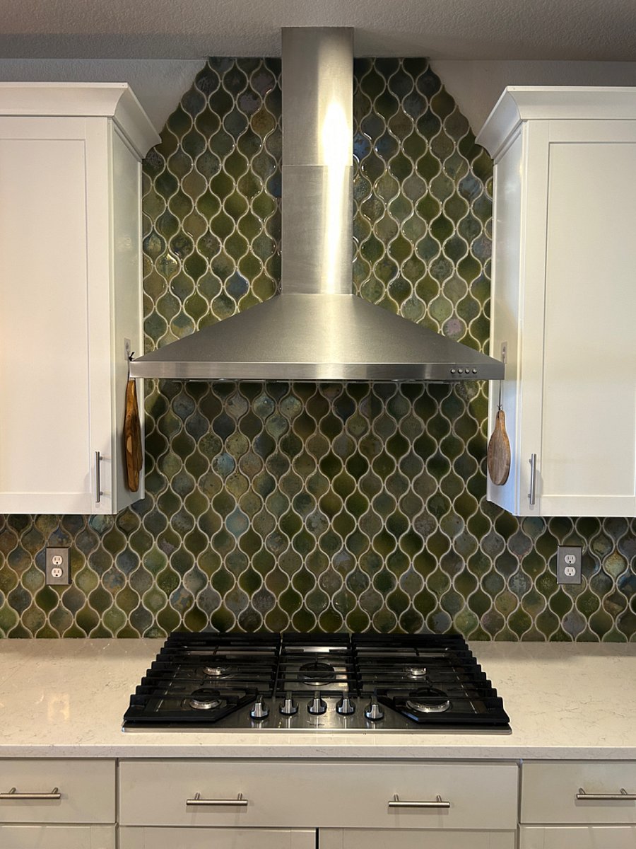 A joy to cook & enjoy meals in this spacious kitchen with beautiful tile work and all the kitchen amenities including expresso machine. 