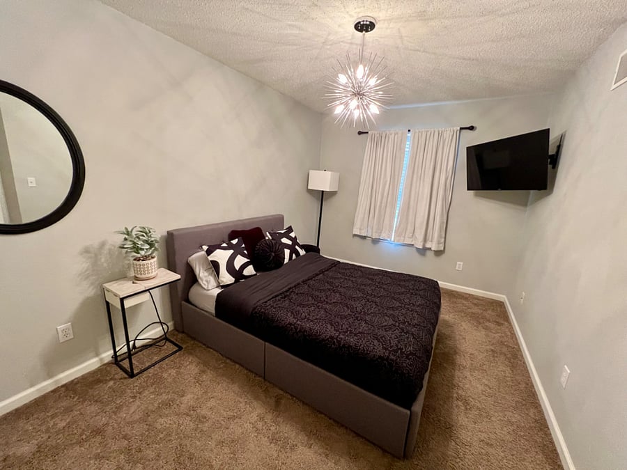 Guest bedroom 2 with large closet and smart tv. Blackout curtains
