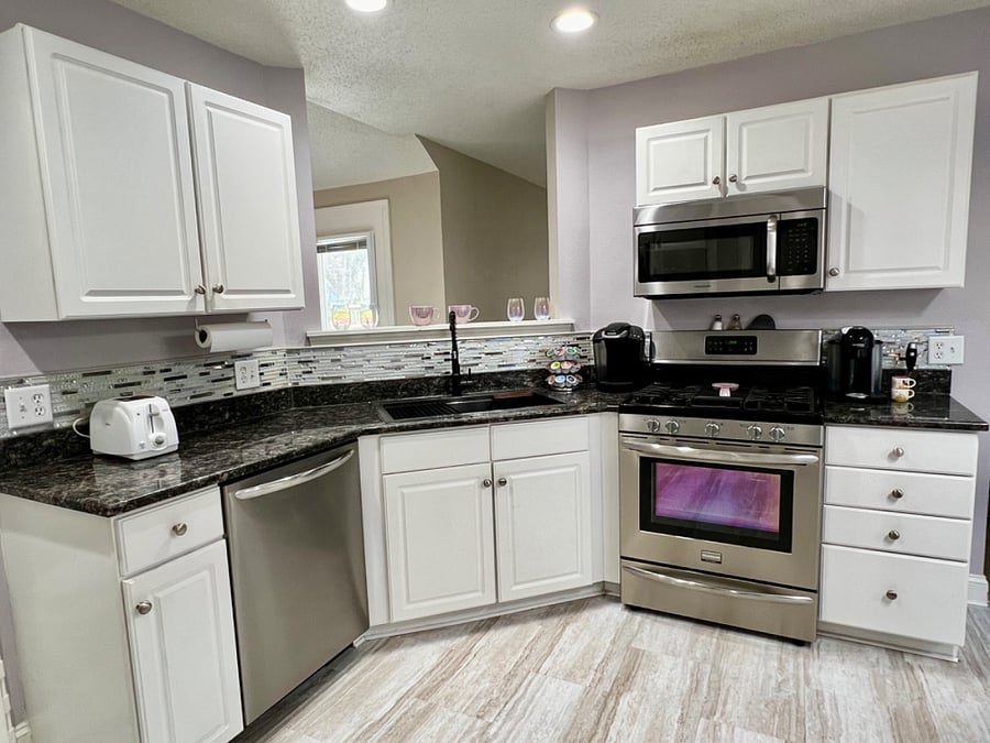 Kitchen with stainless steel workstation sink