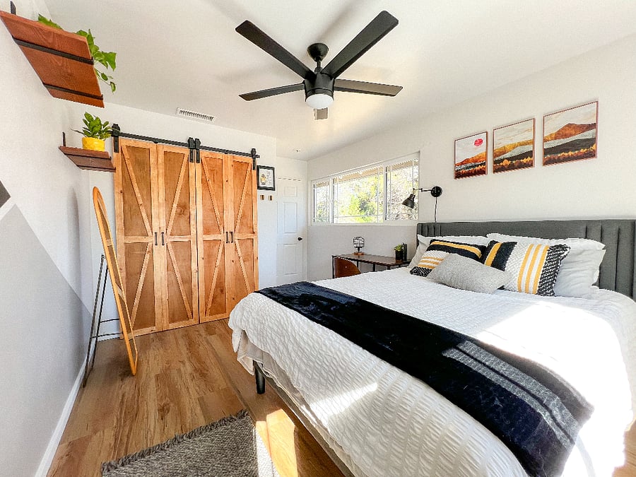 Bedroom 1. Custom barn doors with a closet system