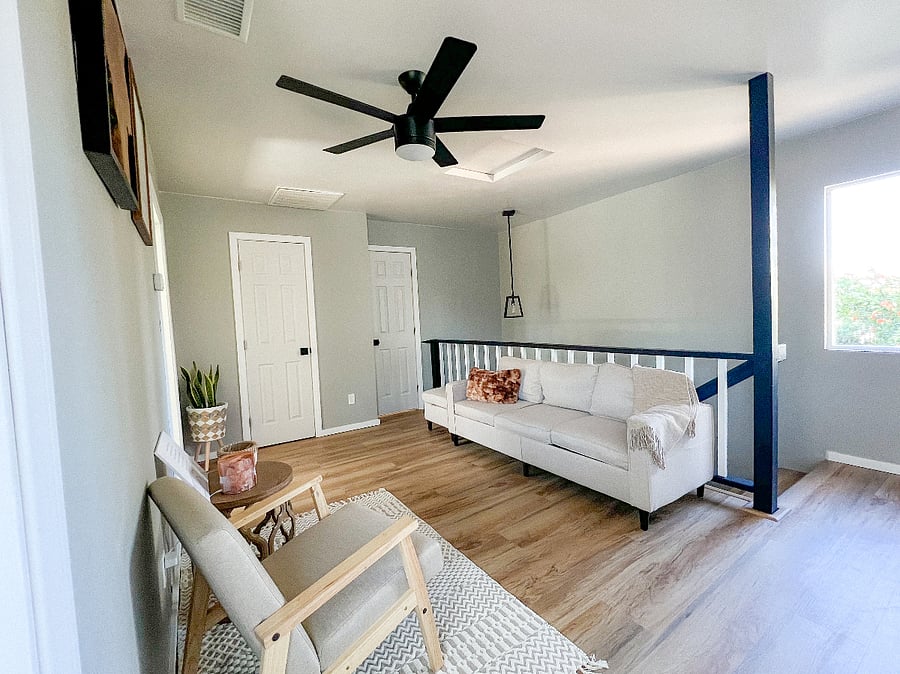 The loft serves as a secondary, quieter more private lounging area. There is a view of our backyard from the loft window.
