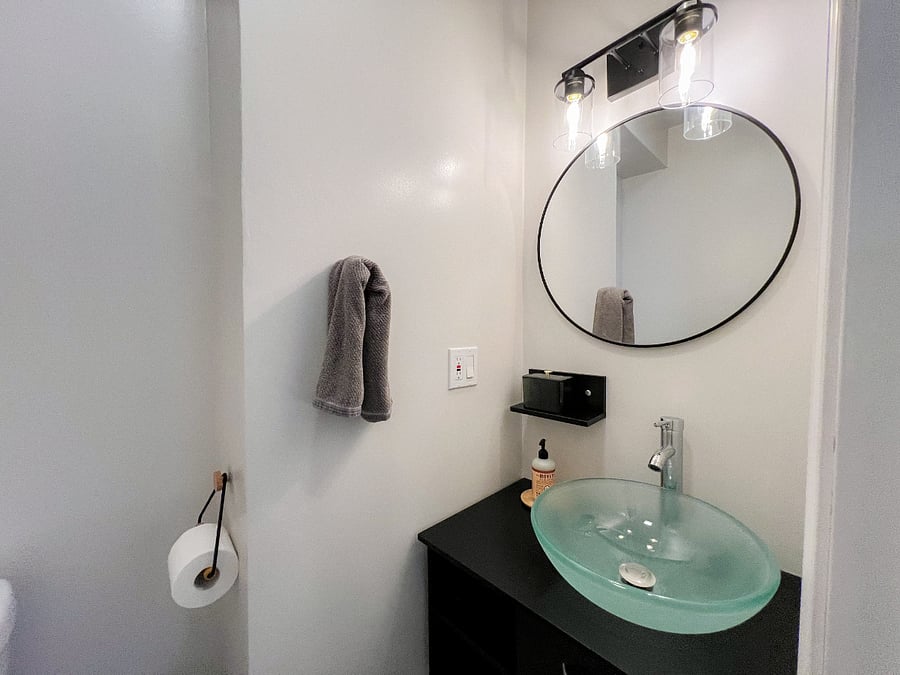 Half bathroom. We renovated the suite to include a second toilet and sink for functionality. 
