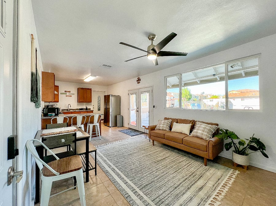 Downstairs living room and kitchen area has lots of natural light and your own access to the backyard.