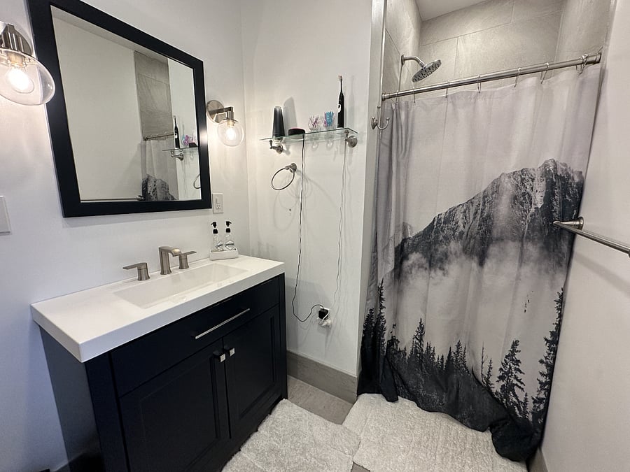 Remodeled bathroom with tile shower
