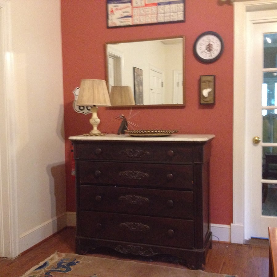 Antique marble-topped dresser has wide and deep drawers for storage. 