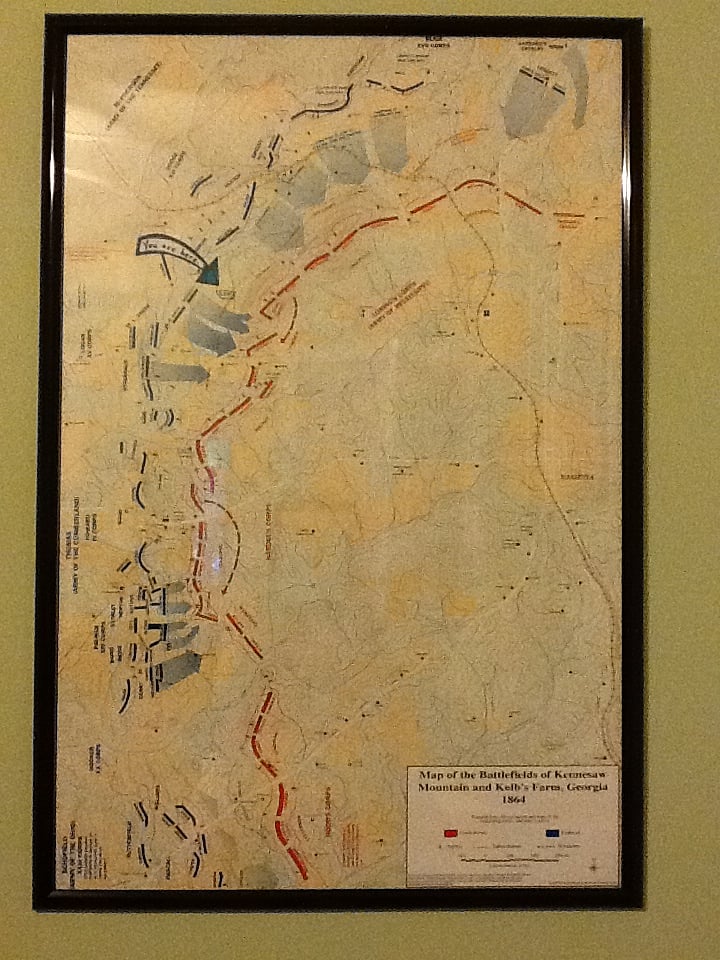 Map on bedroom wall shows park walking trails.