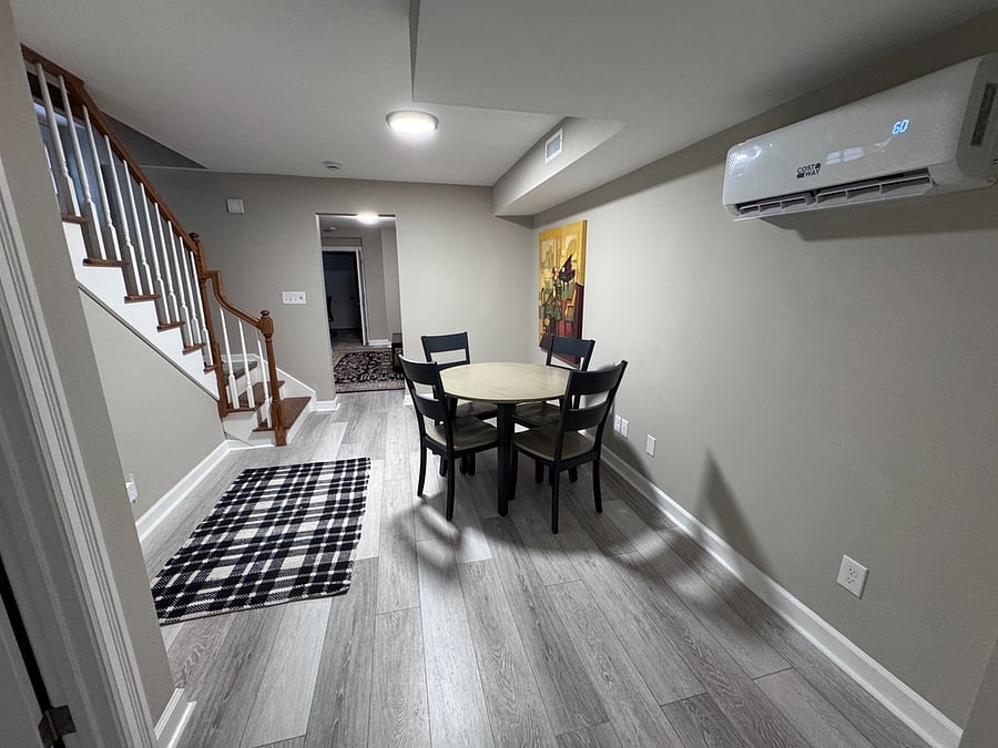 Dining table. Side entrance at stairway. (Upper stairs are now book shelves)