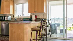 Kitchen area with 3 bar stools