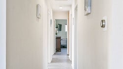 Hallway leading to the bedrooms and the bathroom