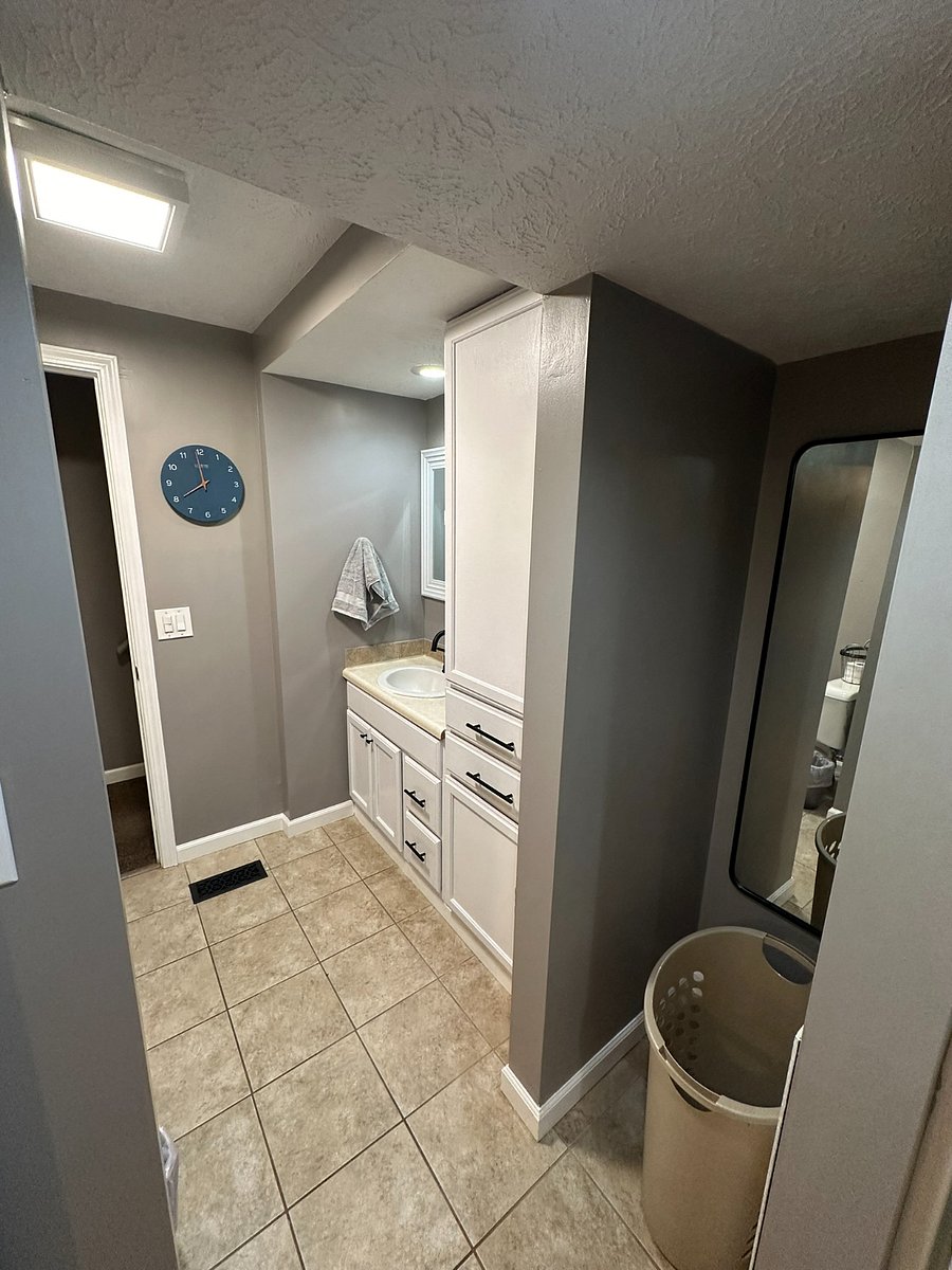 Main-floor bathroom directly across from main-floor bedroom. 