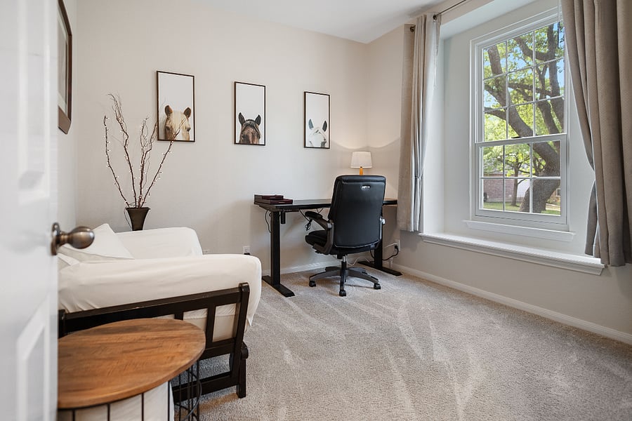 Another secondary bedroom that is flexible to be used as a bedroom with a twin bed, an office or reading room