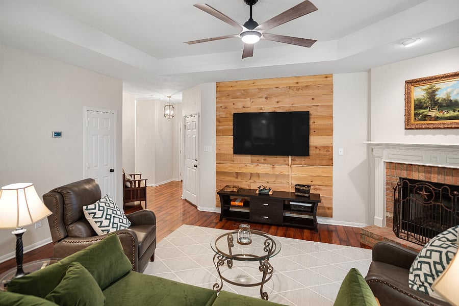 Shut the blackout curtains to watch a movie and cuddle with your dogs and family in a living space with stylish quality furnishings.