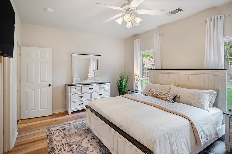 A master bedroom with a walk-in closet and private bathroom
