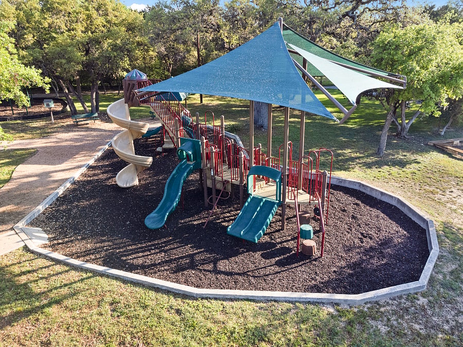 A short walk will take you to the playground and trails at the community center