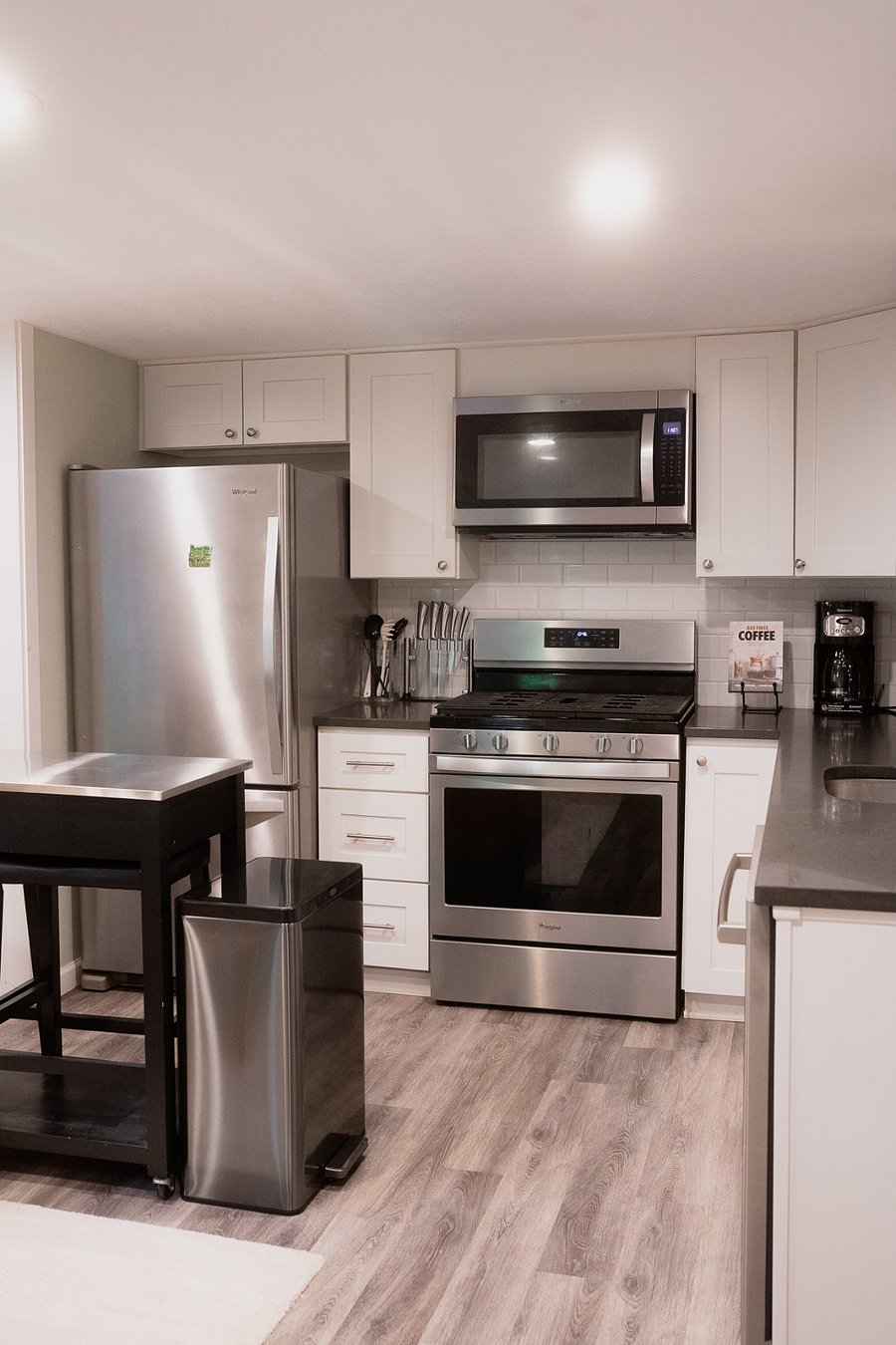 Full kitchen with island and seating