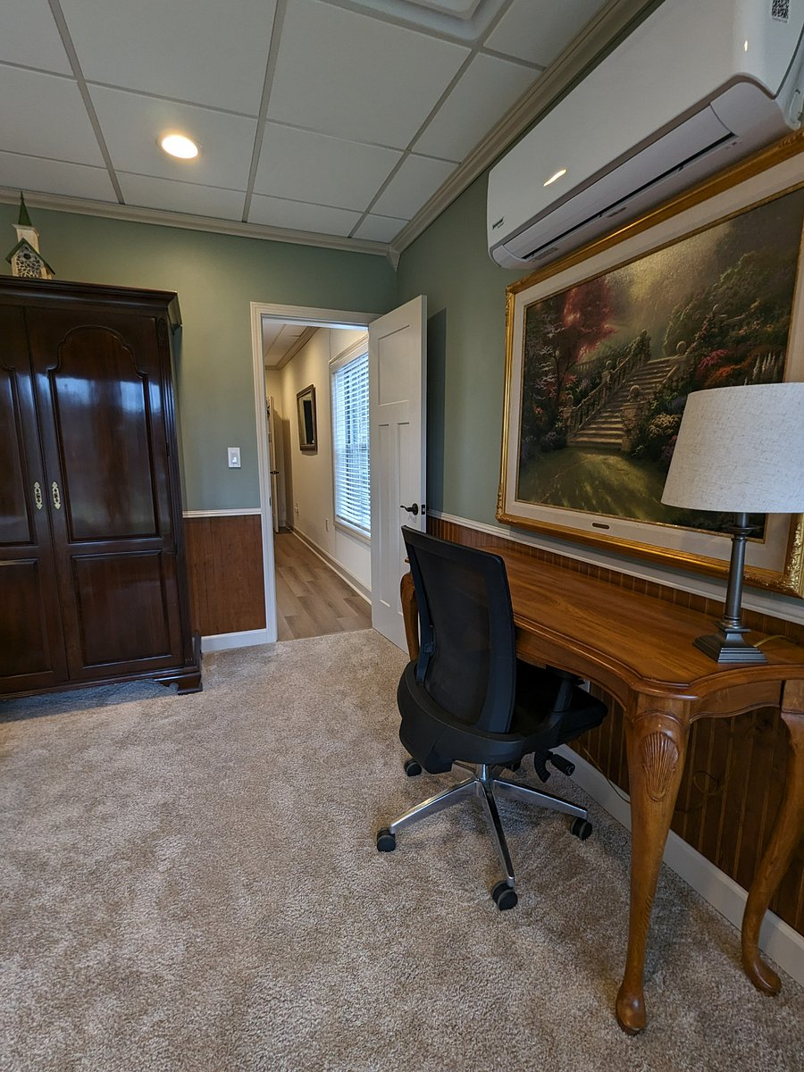 A comfortable desk with a stunning vie of the lake.