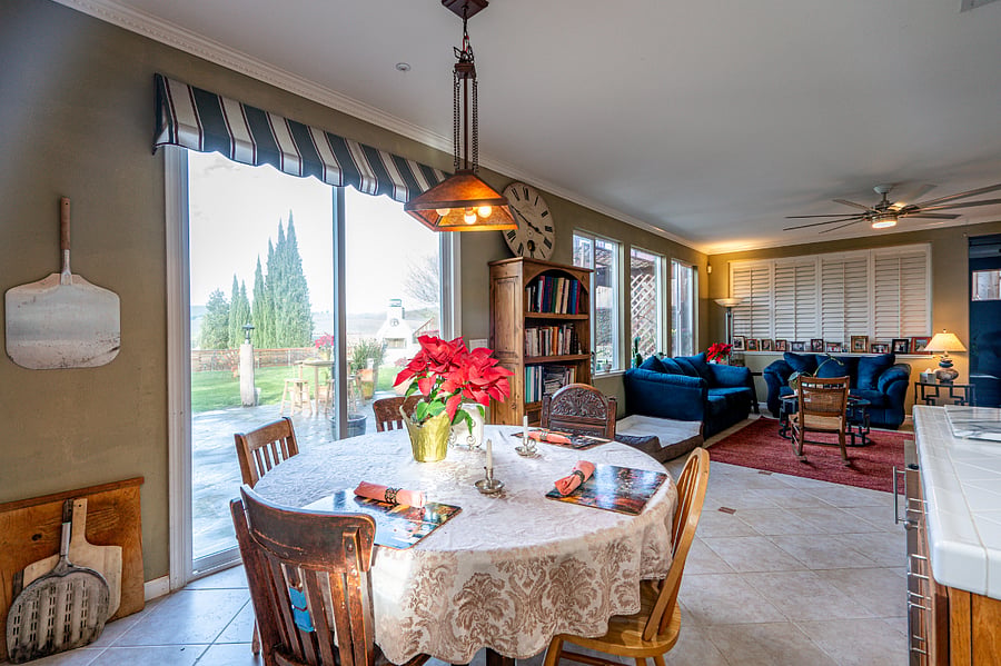The kitchen opens to a shared family room with a wood burning fireplace.