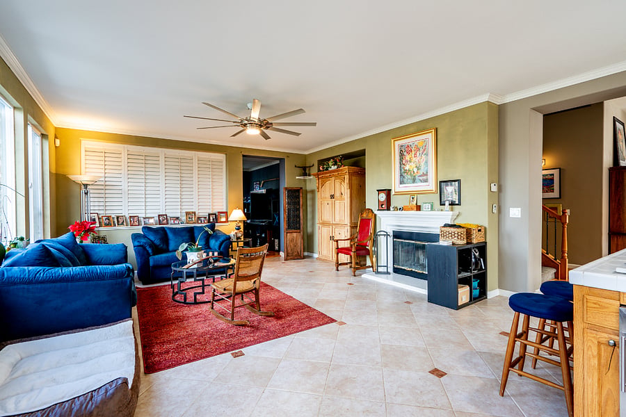 The shared family room with wood burning fireplace.