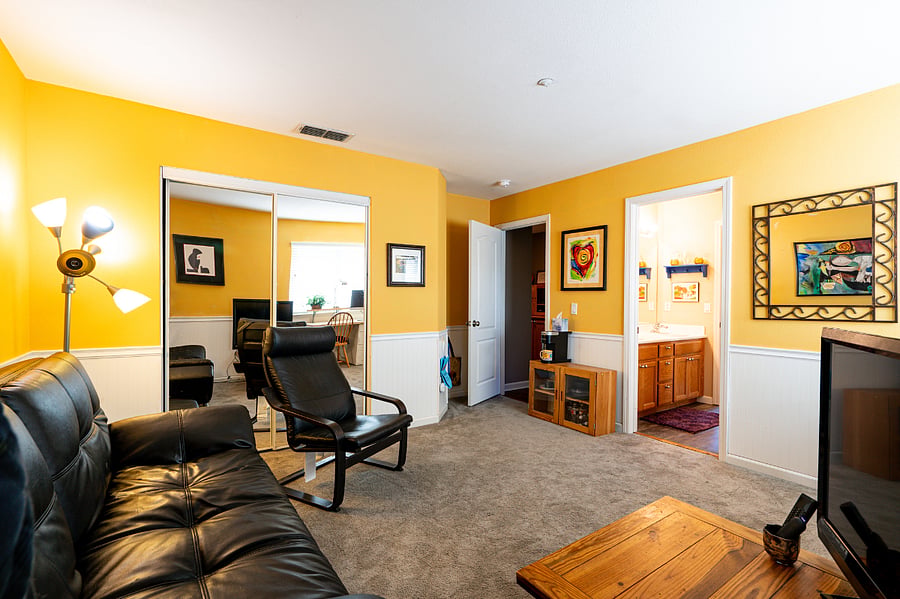 The second bedroom, now media/bonus room. The black couch can be folded down into a bed.