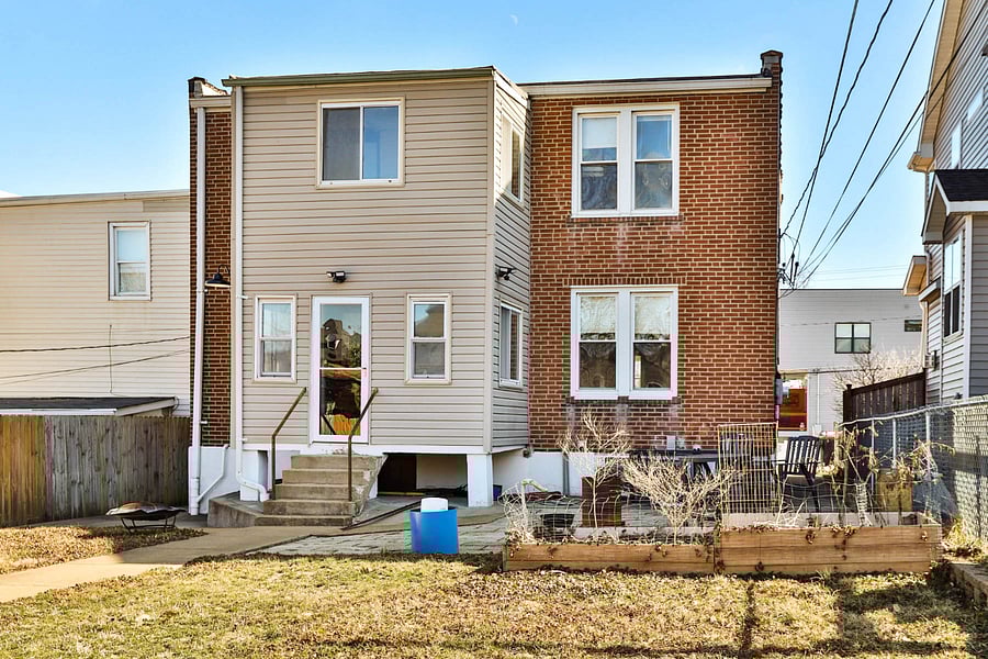 Nice big shared back yard with upstairs long term tenant, fenced on two sides, open to alley and trash/recycling.