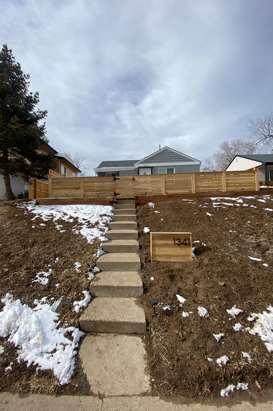New exterior fencing with path for guest house guest to find their way toward their entrance