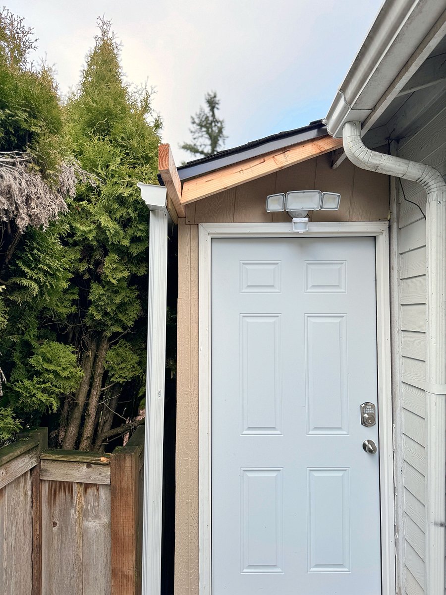 Front Door Entrance is entirely separate from the main house on the property.  From the garage driveway, you will enter thru a gate and down a short walkway.  Floodlight installed for security.