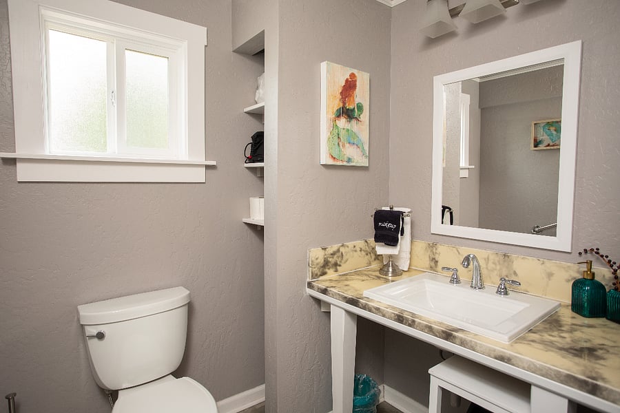 Teal Bathroom - ADA friendly counter with space heater included for colder days.