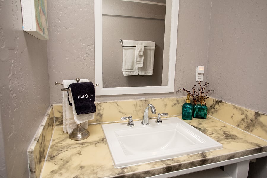 Teal Bathroom - full size tub/shower with towels included in biweekly linen exchange.