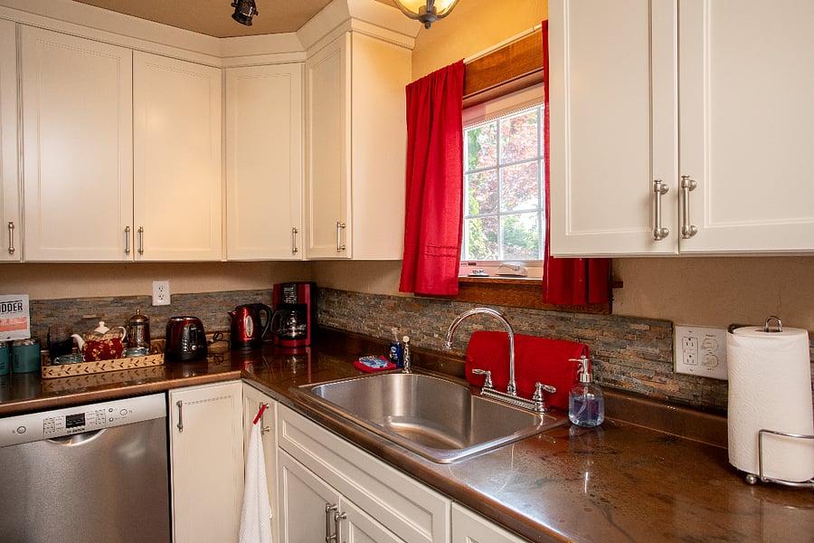 Full Kitchen - coffeemaker, coffee grinder, toaster, hot water kettle and farm-house sink