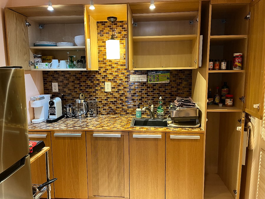 Kitchenette with plenty of space for groceries, Keurig coffee maker, hot water kettle, all utensils, plates/cups, tupperware, large bowl, measuring spoons/cups.