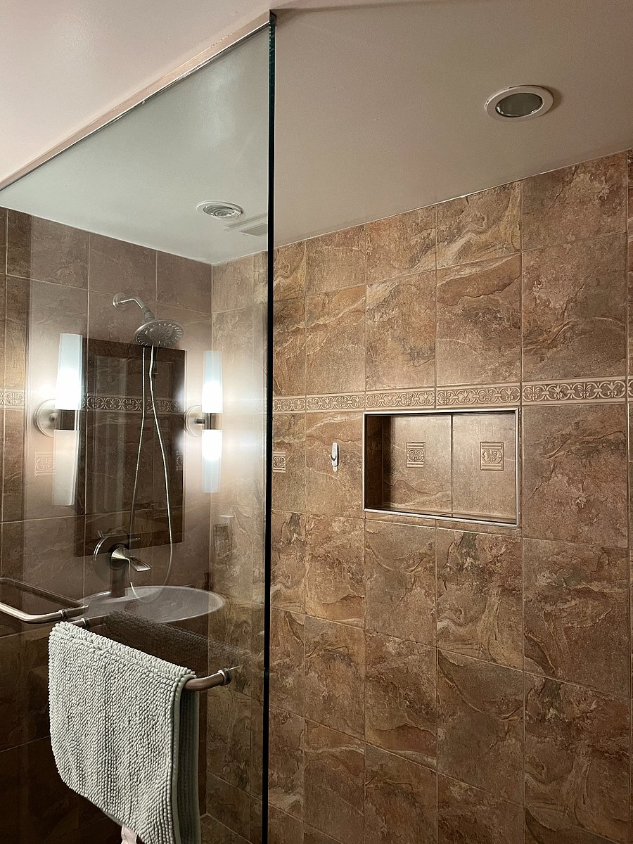 Built in shelving for shampoo, conditioner, body wash.