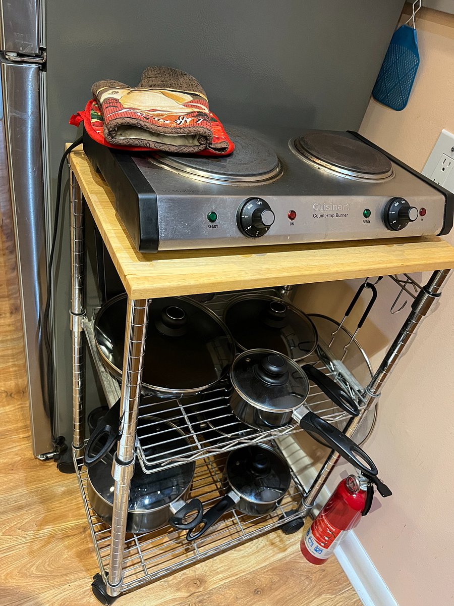 2 burner portable Cuisinart electric stove with pots and pans. Pot holders.