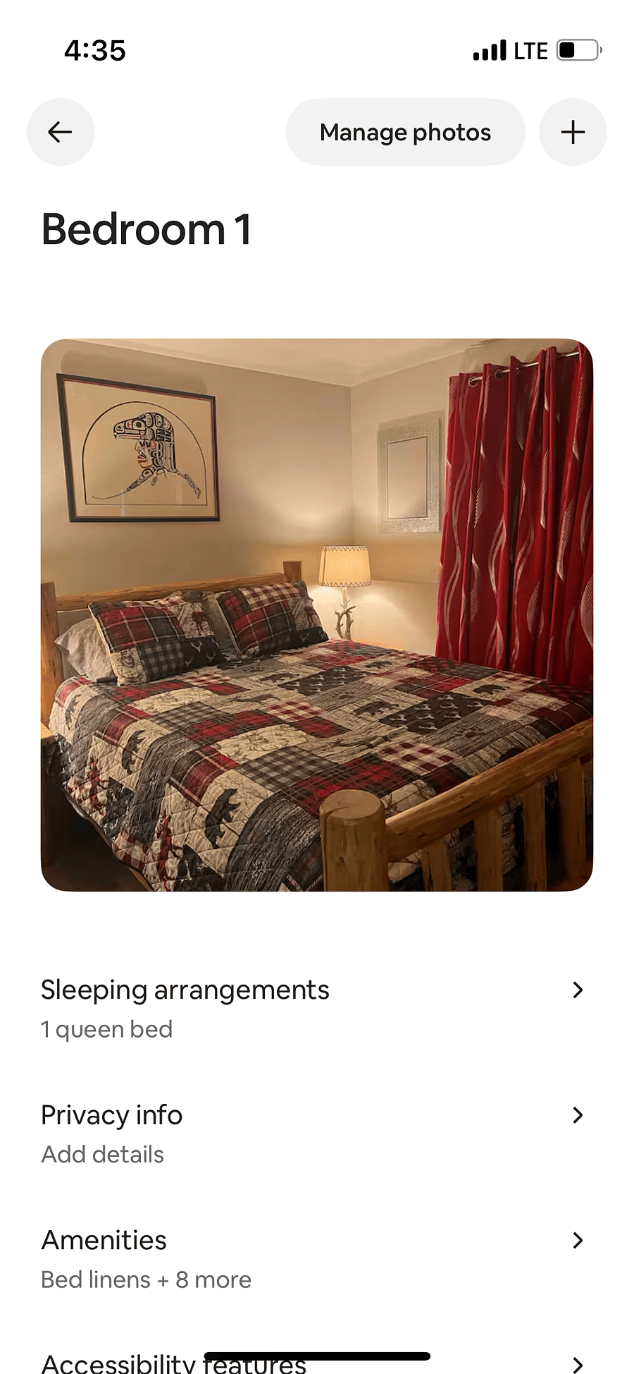 Master bedroom with queen bed and small wall mounted tv