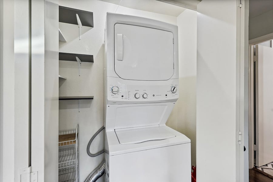 Spacious pantry with large-capacity washer/dryer.