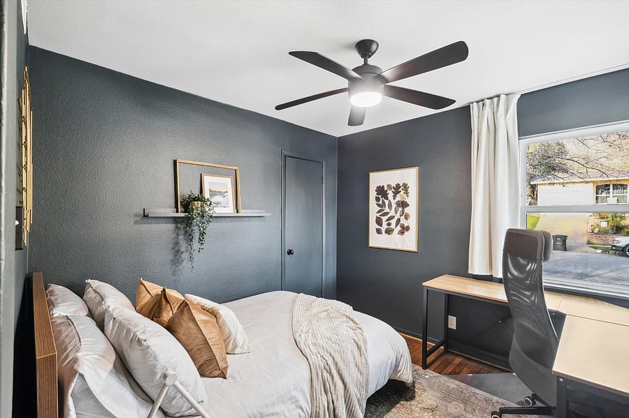 Cozy guest bedroom/office, complete with a comfy full-size bed/mattress, blackout curtains, a closet for storage, and a corner desk with sweeping outdoor views - best seat in the house - perfect set up for computer work - comfy office chair included!