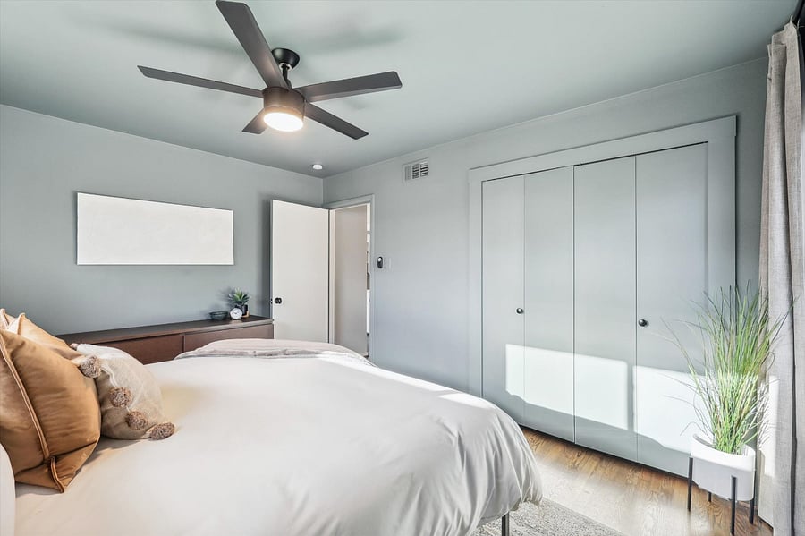 Moody master bedroom, complete with a brand new king-size bed/mattress, blackout curtains, and plenty of storage space in the chest of drawers/closet.