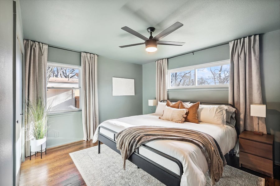 Moody master bedroom, complete with a brand new king-size bed/mattress, blackout curtains, and plenty of storage space in the chest of drawers/closet.
