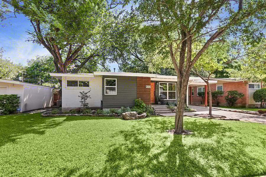 Front-left of home. Freshly renovated and modernized. Large, sweeping canopy of trees. Beautiful landscaping. Covered parking.