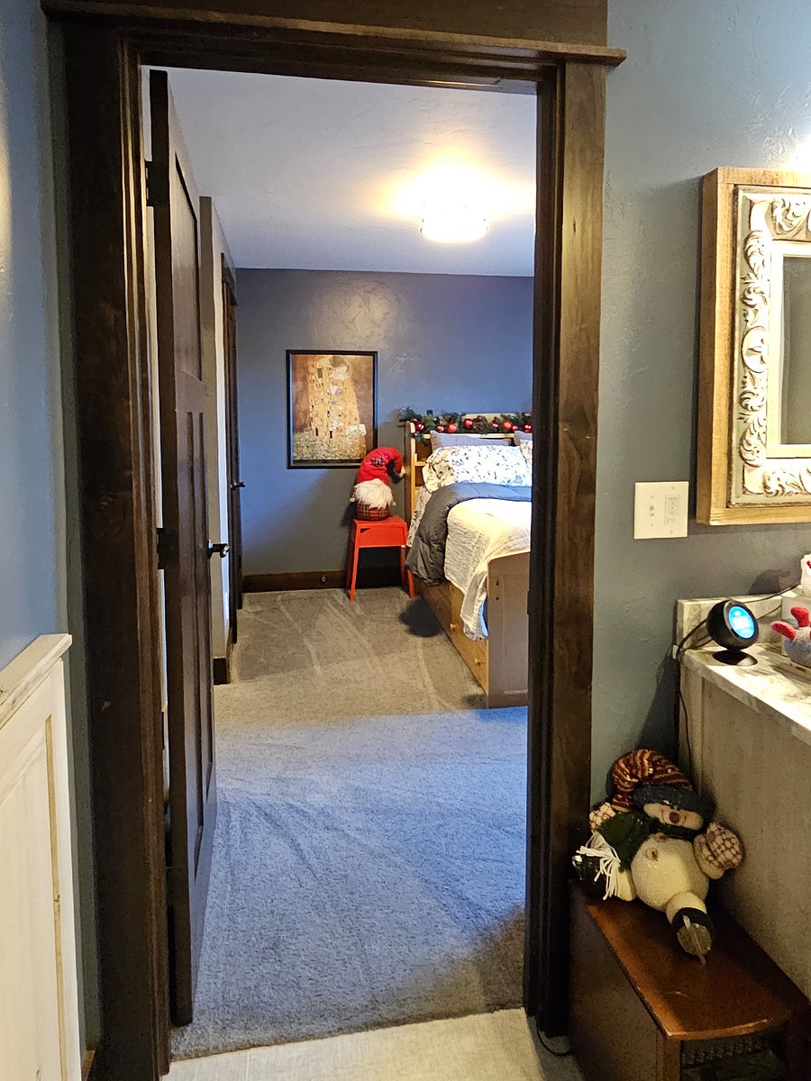 View of 12x12 bedroom from bathroom door entry to bedroom.