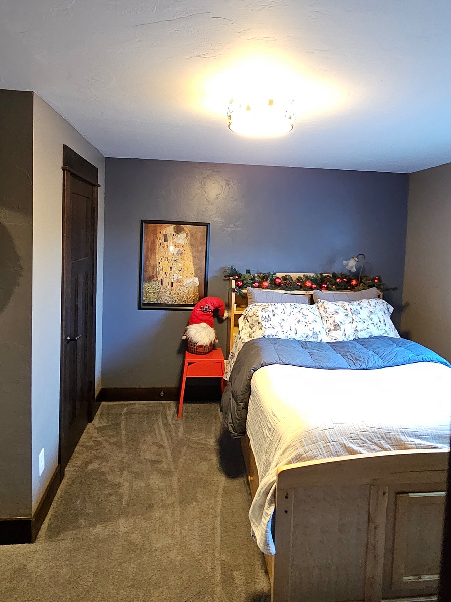 Another view of bed, 4 large drawers in base of bed and small nightstand. Bed has a bookcase headboard with a light and room for your books, alarm, etc.