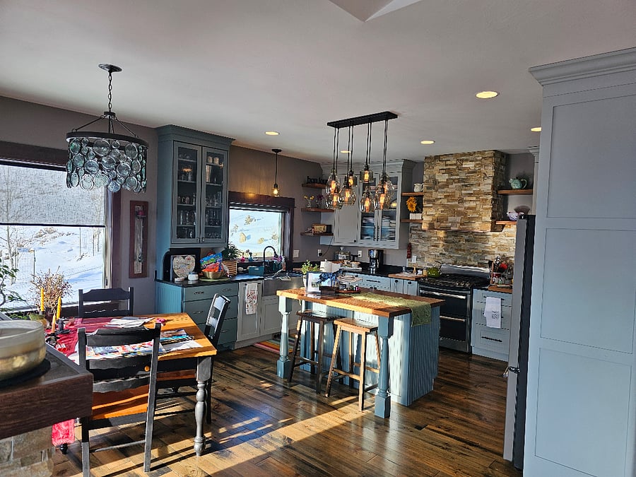 Full view of upstairs kitchen/island and dining area. Full of light and views of nature.