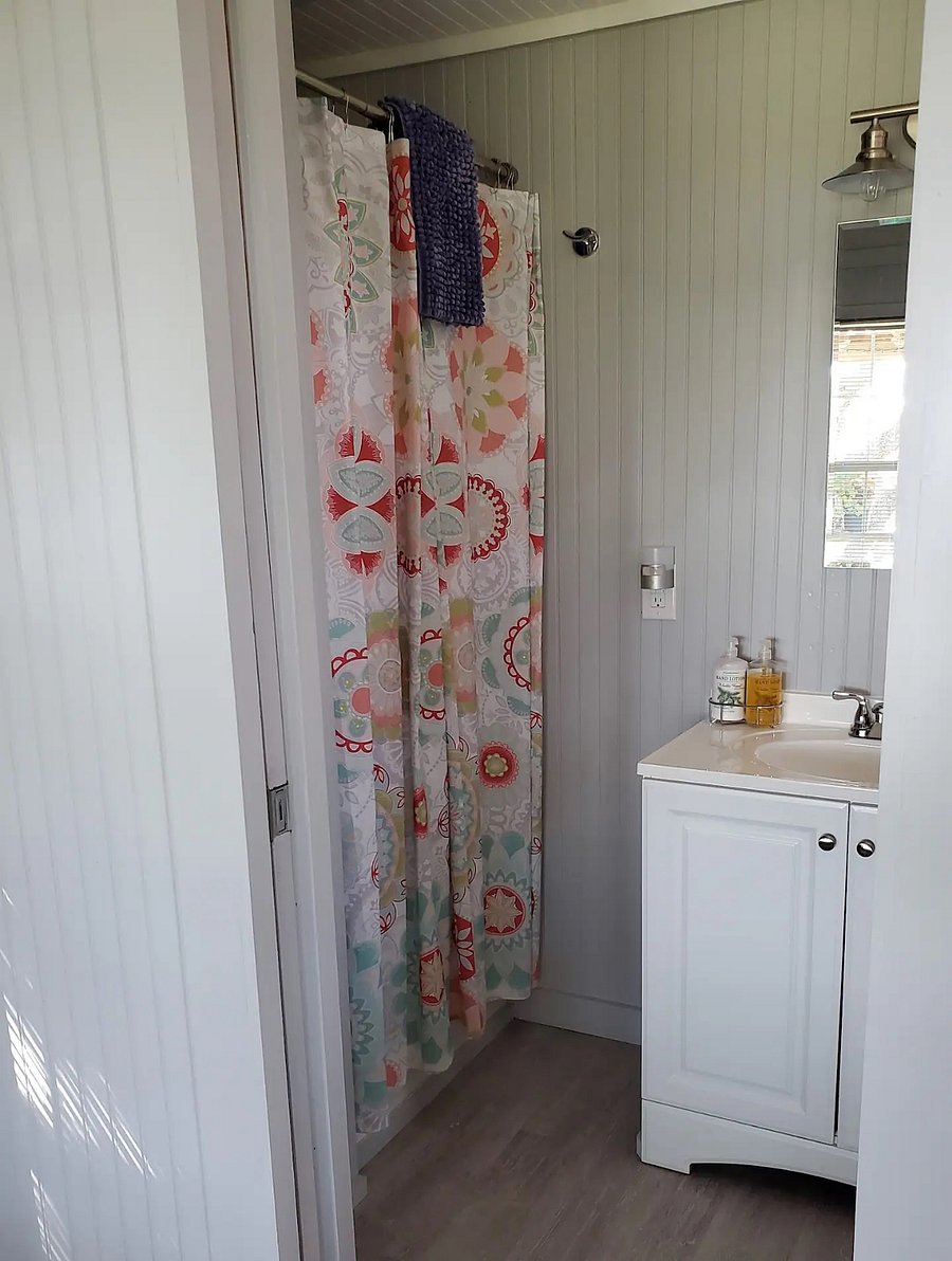 Bathroom with small closet and shower