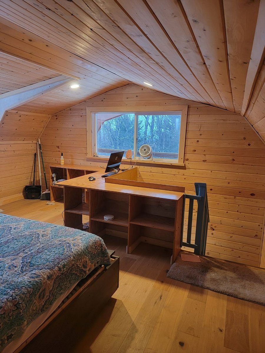 Oak custom shelving with complimentary work station for laptop with printer and view