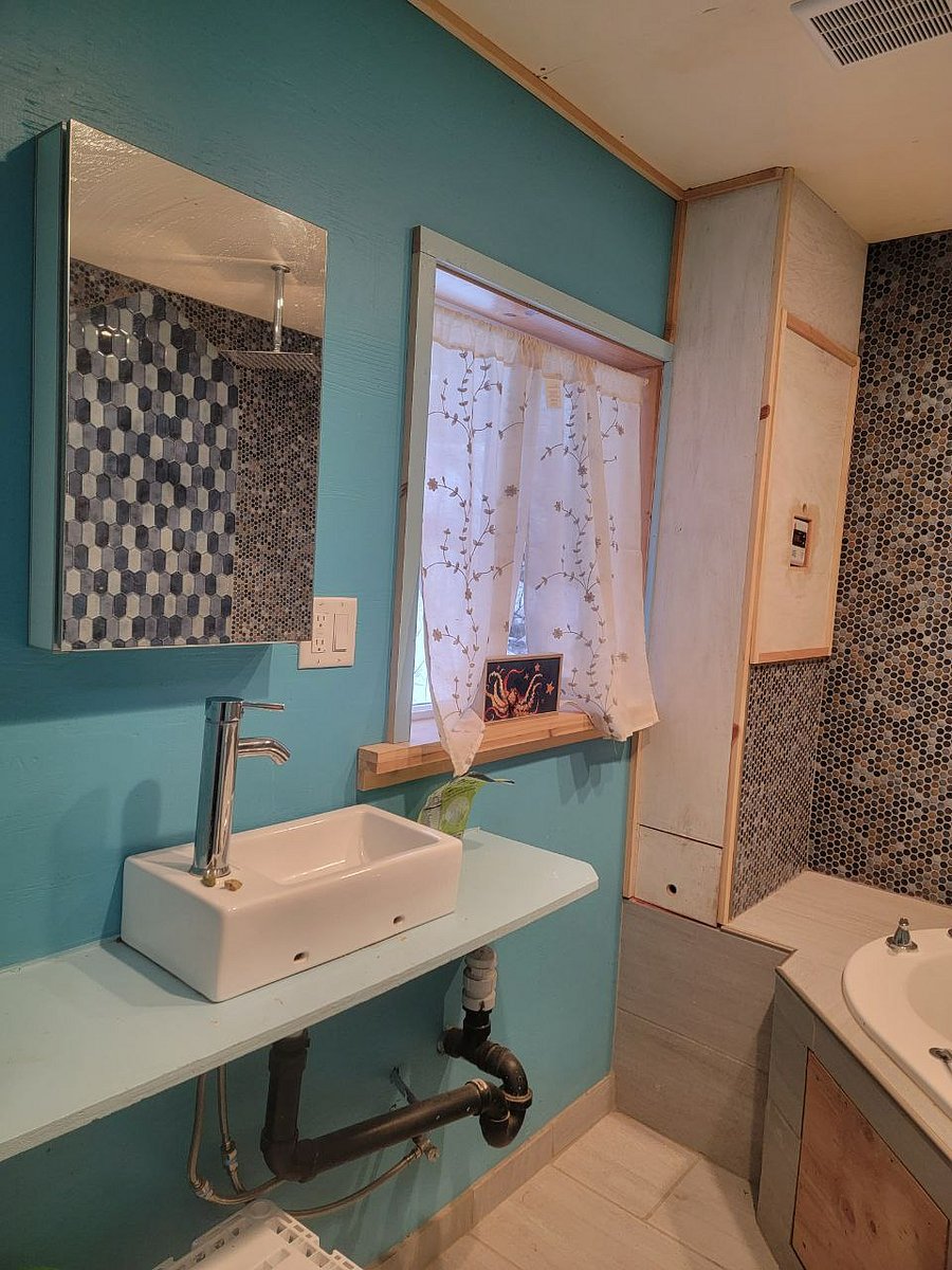 Bathroom with on demand natural gas hot water heater